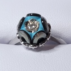 "Mercy Pearl" by Galetea. A turquoise bead was covered by Tahitian pearl nacre. Centered with a diamond. 18KWG.
